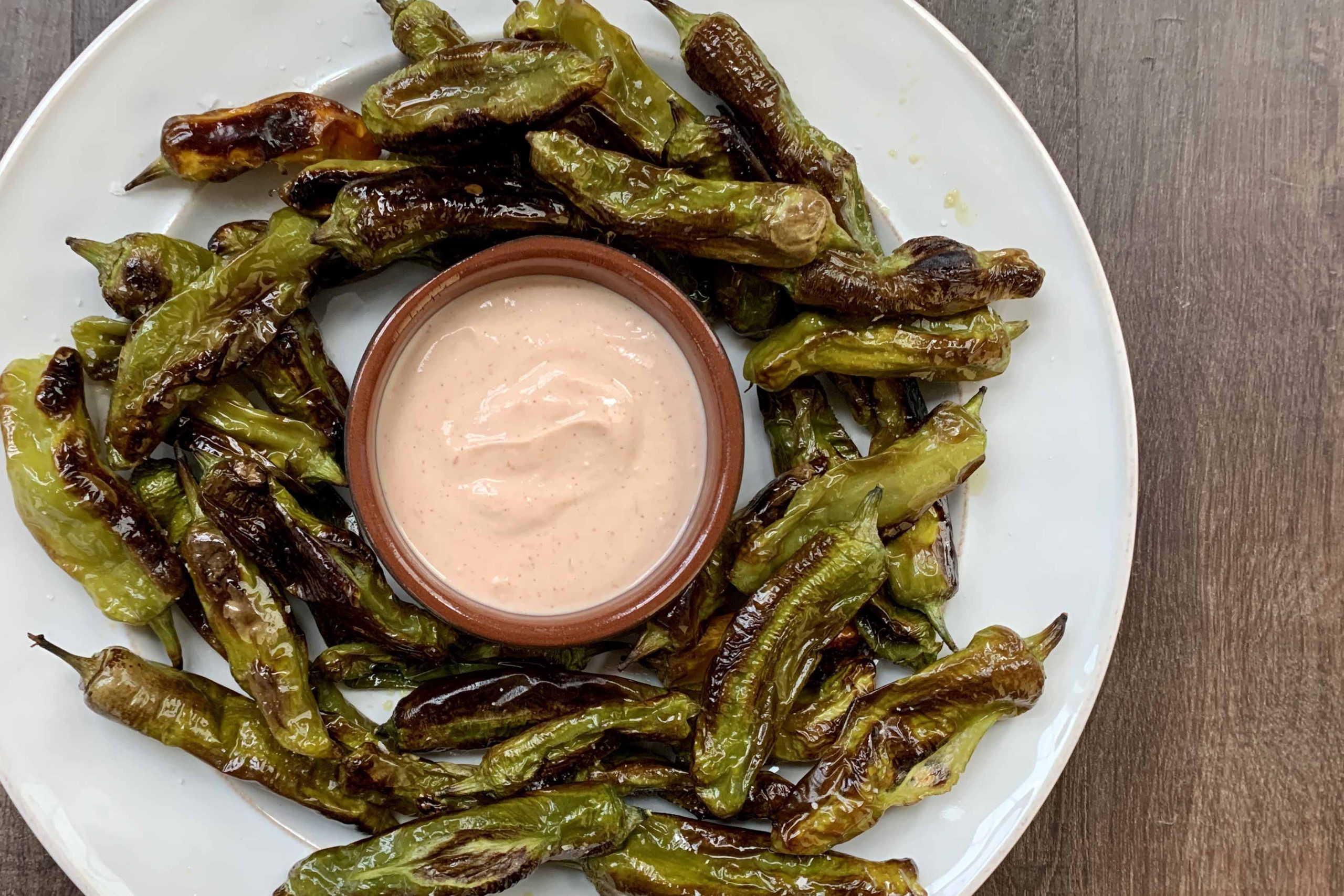 Roasted Shishito Peppers with Spicy Yogurt Sauce